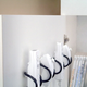 Illustration for article titled Wall Clips Organize Controllers In Wiimote Locations